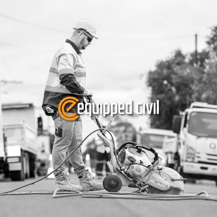 Icon Web Design Adelaide. Image of an Equipped Civil worker cutting the bitumen on a road.
