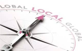 Icon Web Design Adelaide - photo of a compass pointing to the word 'local'.