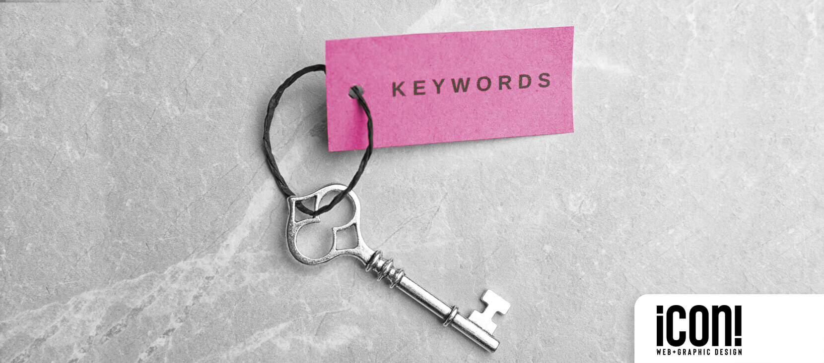 Icon Graphic Design Adelaide blog image of an old fasion key with a pink tag with the words 'keywords' on it in black text.